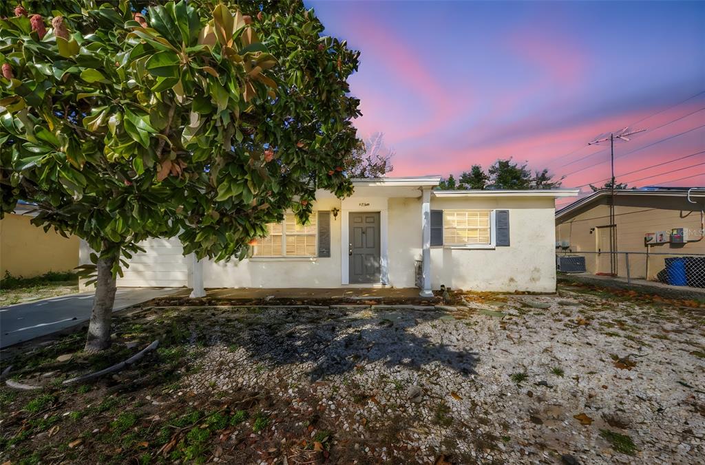 8053 Dedham Drive Port Richey, FL 34668 - Photo 1 of 1 a backyard of a house