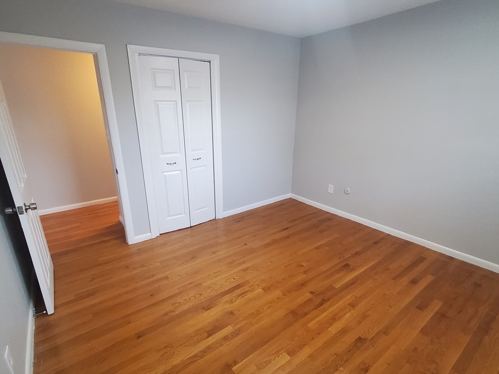 24 Colgate Road, Unit 5 Boston, MA 02131 - Photo 7 of 13 wooden floor in an empty room