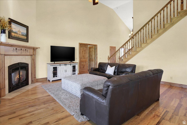 667 Hardscrabble Road Morgan, UT 84050 - Photo 15 of 51 Living area with light wood finished floors, a fireplace, and vaulted ceiling