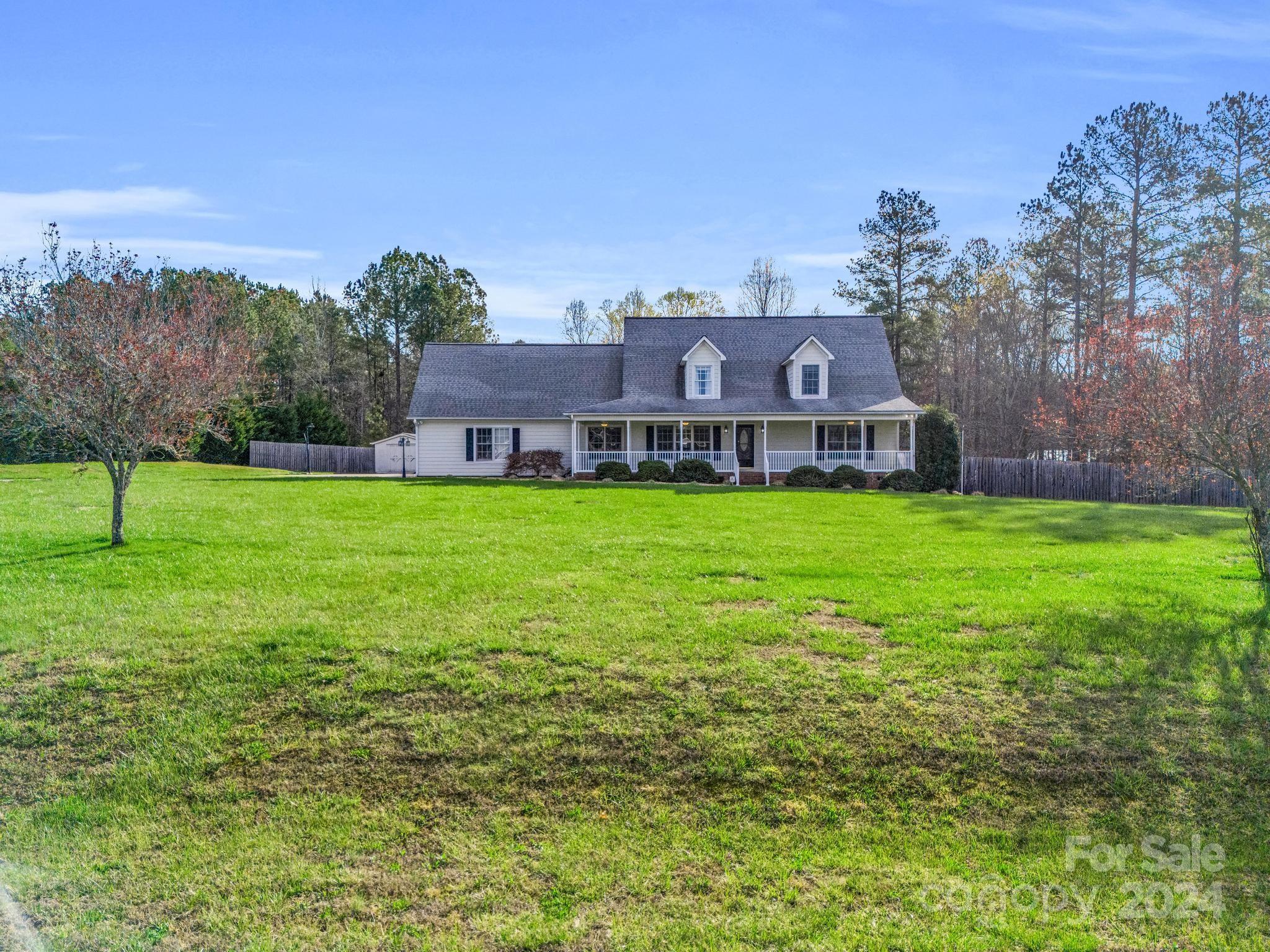 211 Brians Way Rutherfordton, NC 28139 - Photo 3 of 46 a view of a house with a big yard and large trees
