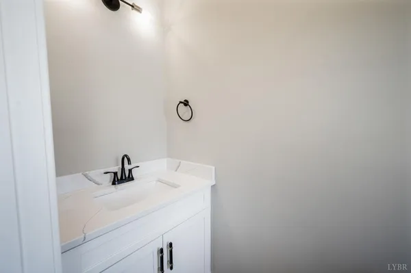 a bathroom with a sink and mirror