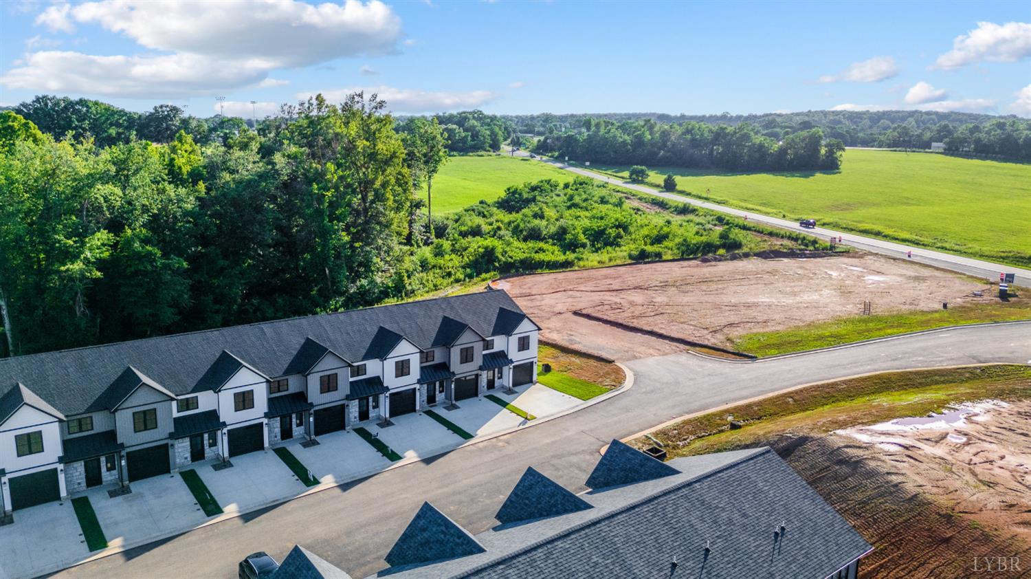 71 Luke Court Rustburg, VA 24588 - Photo 2 of 37 an aerial view of a swimming pool with outdoor seating and yard in the back