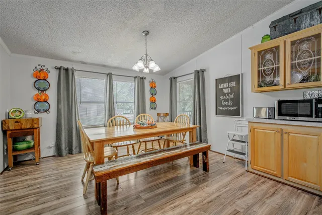 a kitchen with stainless steel appliances granite countertop a sink a stove and refrigerator