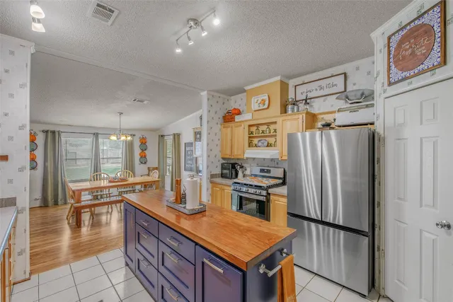 a bed room with a bed and a chandelier