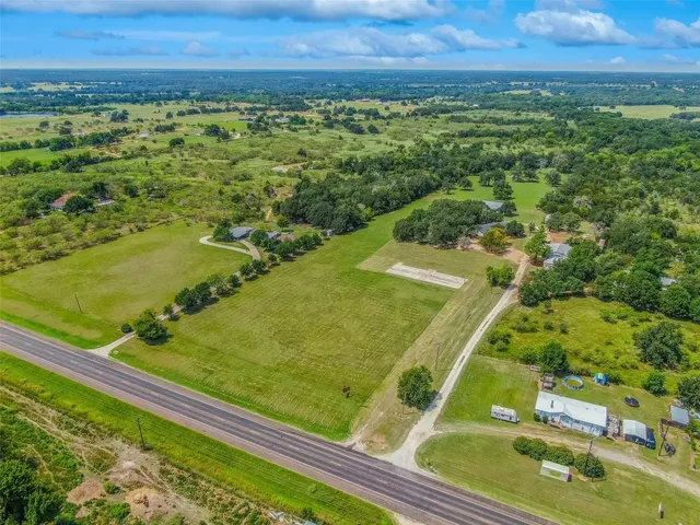 a view of a swimming pool with an outdoor space and seating area