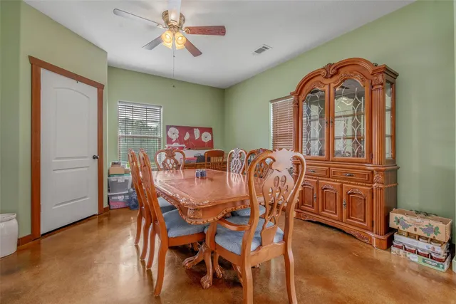 a kitchen with refrigerator cabinets and wooden floor