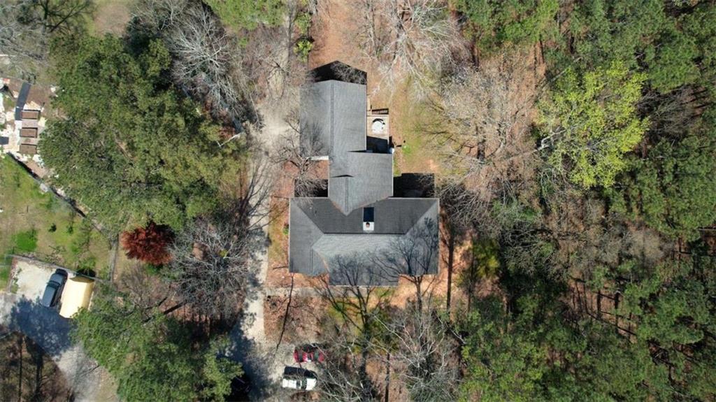 2740 Dennard Road Northeast Conyers, GA 30013 - Photo 47 of 51 an aerial view of a house with a yard