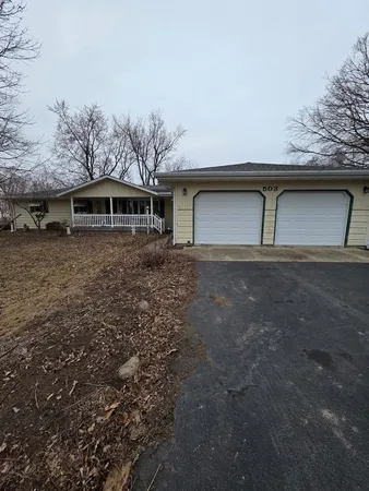 a front view of a house with yard