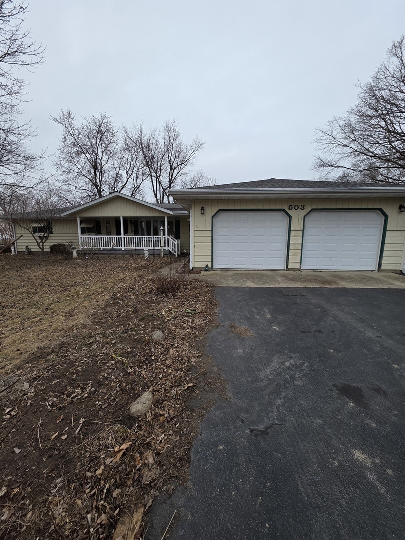 a front view of a house with yard