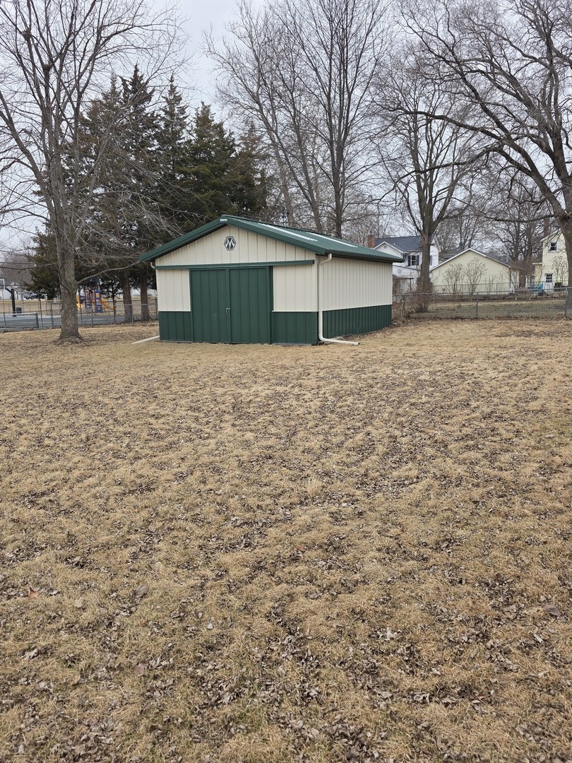 503 North Walnut Street Delavan, IL 61734 - Photo 12 of 32 a house with trees in front of it