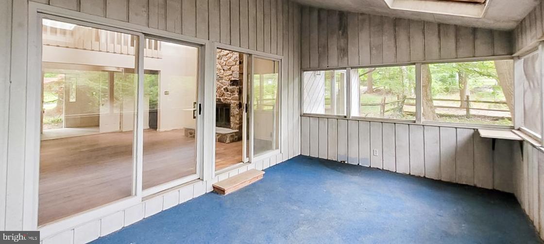 533 Pugh Road Wayne, PA 19087 - Photo 12 of 27 a view of an empty room with wooden floor and a window