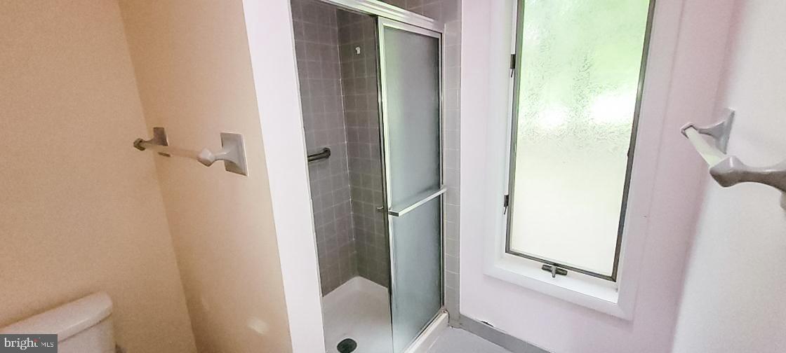 533 Pugh Road Wayne, PA 19087 - Photo 22 of 27 a bathroom with a glass shower door