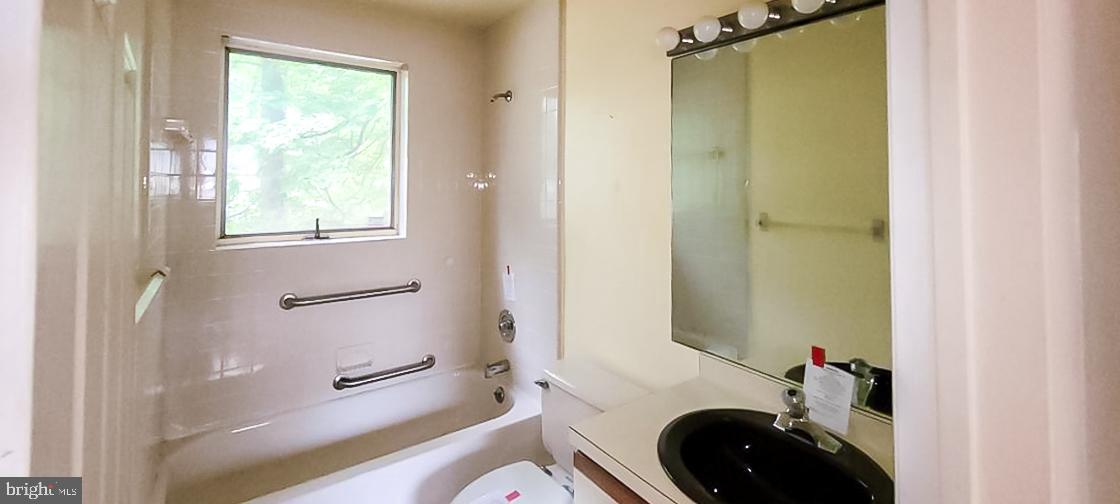 533 Pugh Road Wayne, PA 19087 - Photo 23 of 27 a bathroom with a granite countertop toilet sink and shower