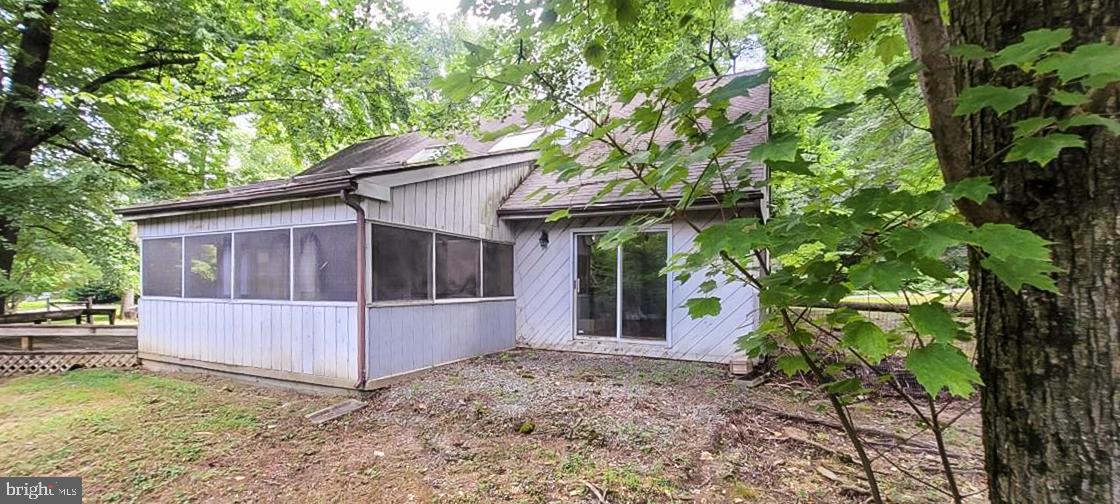 533 Pugh Road Wayne, PA 19087 - Photo 26 of 27 a view of a house with a small yard and large tree