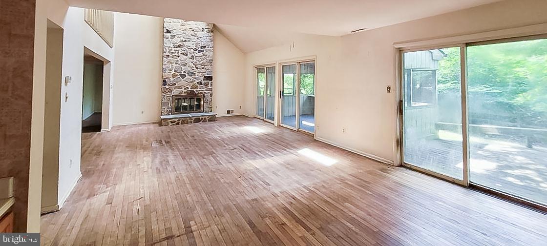533 Pugh Road Wayne, PA 19087 - Photo 5 of 27 an empty room with wooden floor and windows