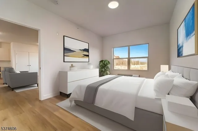 a bedroom with a bed and a couch