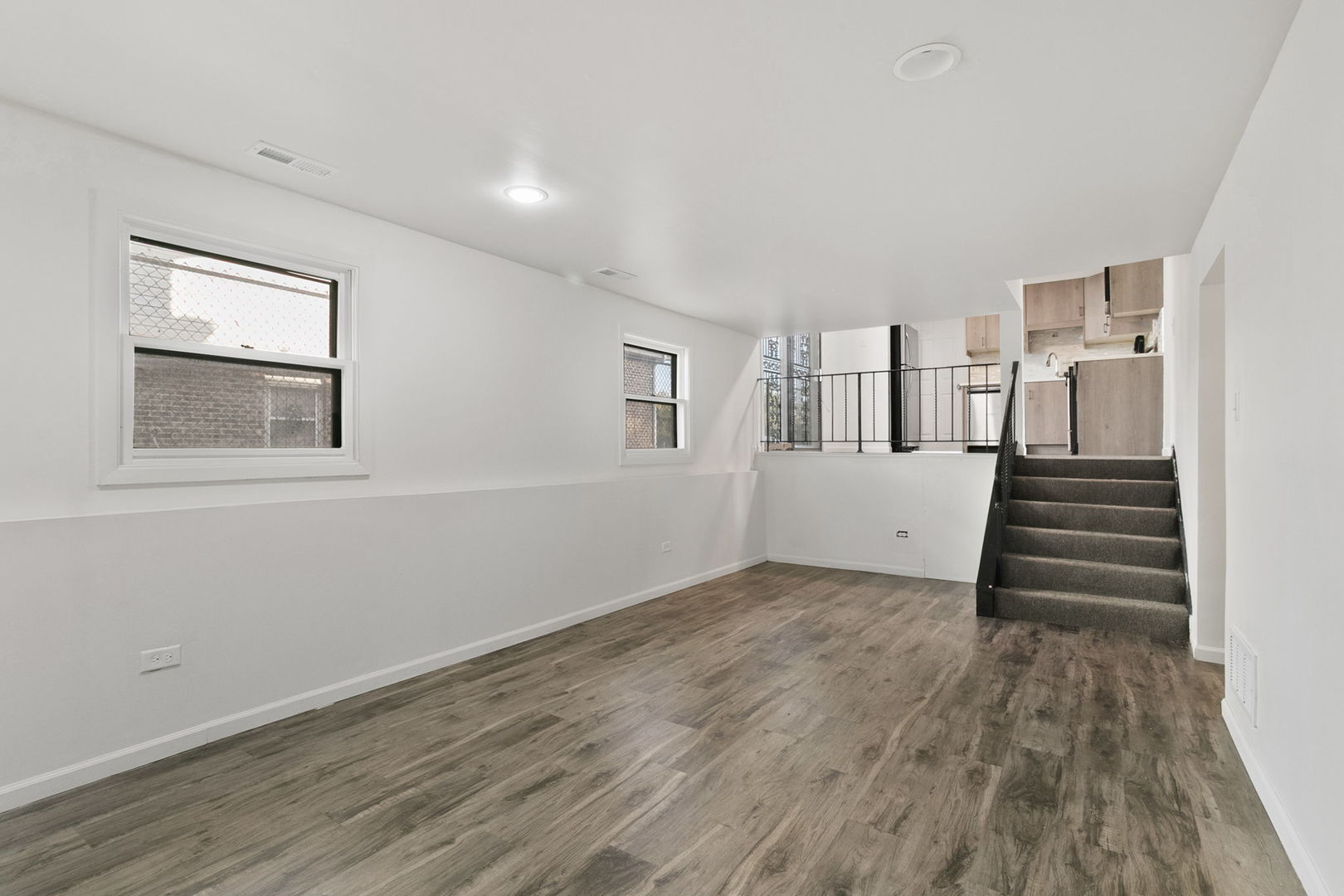2236 West 157th Place Markham, IL 60426 - Photo 12 of 14 a view of a livingroom with wooden floor and stairs