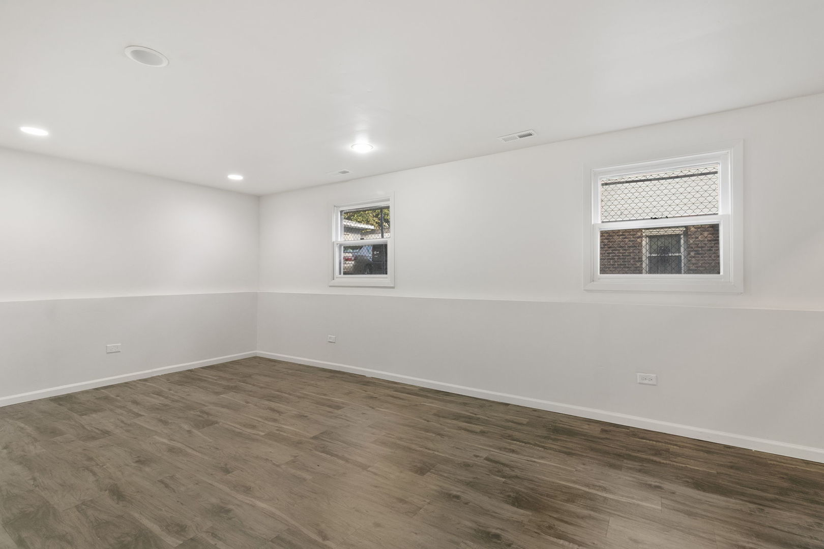 2236 West 157th Place Markham, IL 60426 - Photo 13 of 14 an empty room with wooden floor and windows