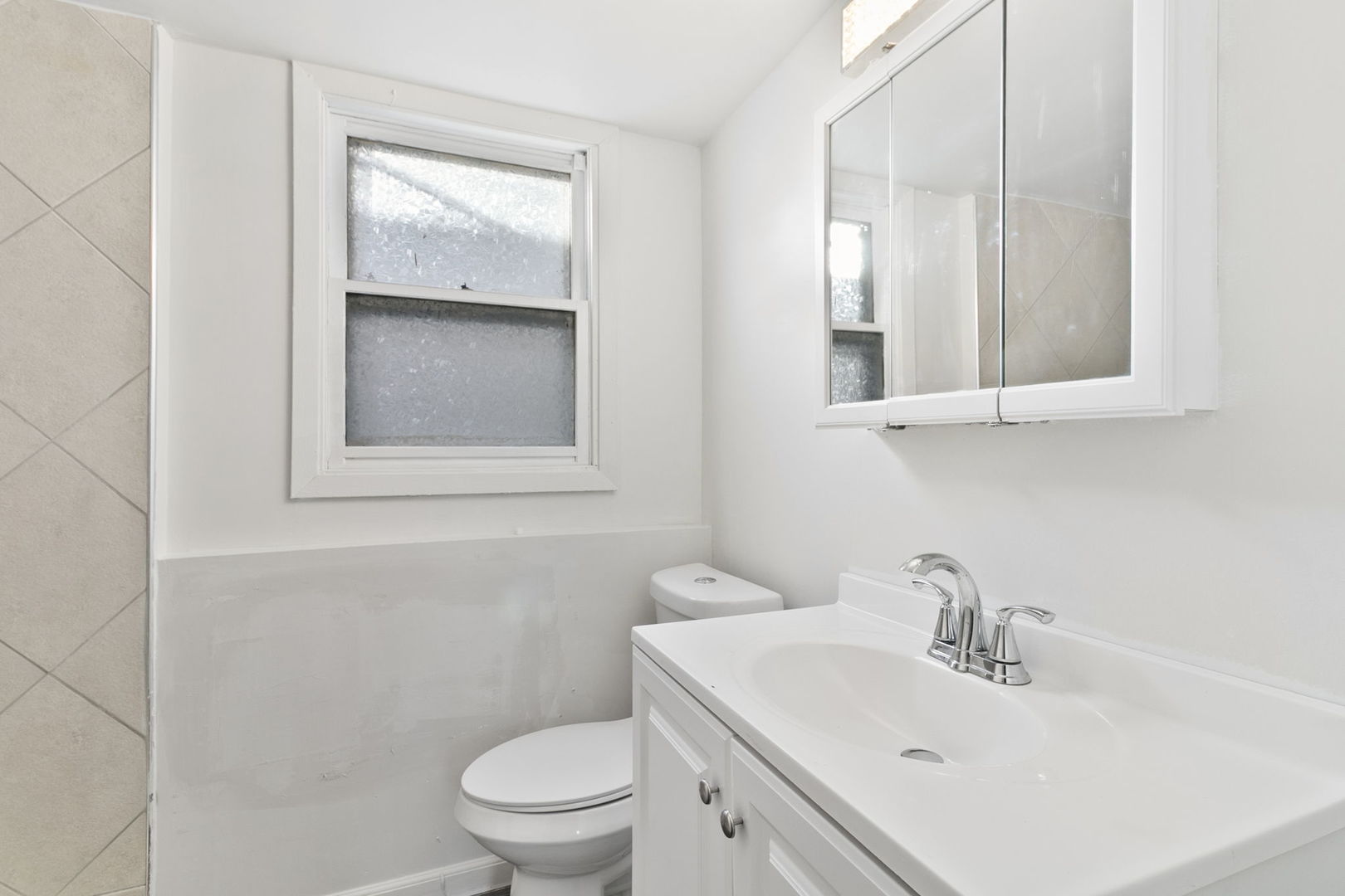 2236 West 157th Place Markham, IL 60426 - Photo 14 of 14 a bathroom with a sink toilet and mirror
