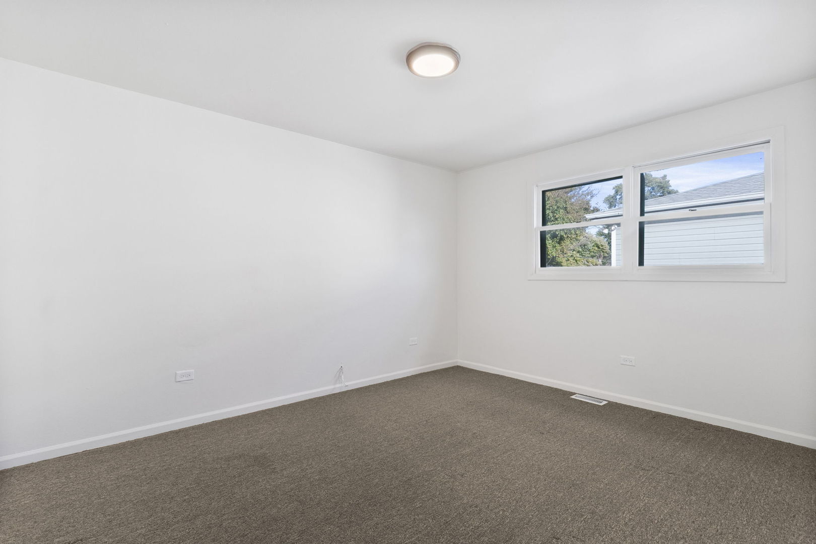 2236 West 157th Place Markham, IL 60426 - Photo 9 of 14 an empty room with a window