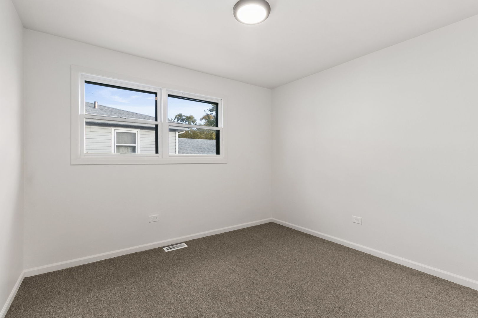 2236 West 157th Place Markham, IL 60426 - Photo 10 of 14 an empty room with a window