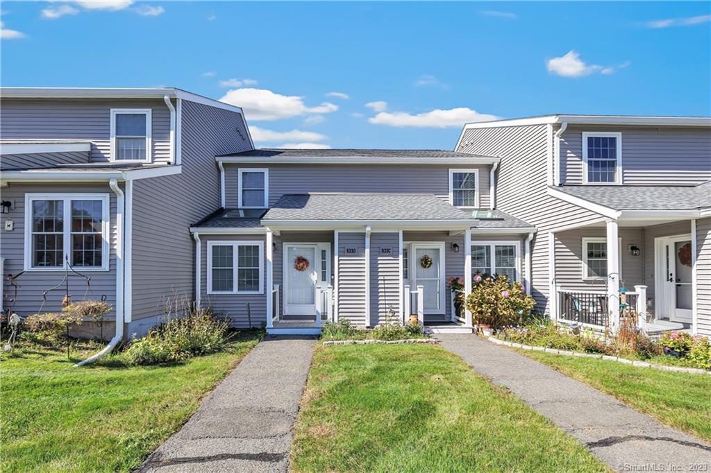 833 Long Hill Road, Unit D Middletown, CT 06457 - Photo 1 of 1 a front view of a house with garden