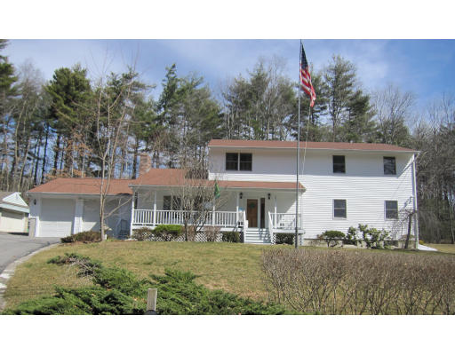 291 Spring Road Dracut, MA 01826 - Photo 1 of 1 a view of a house with a backyard