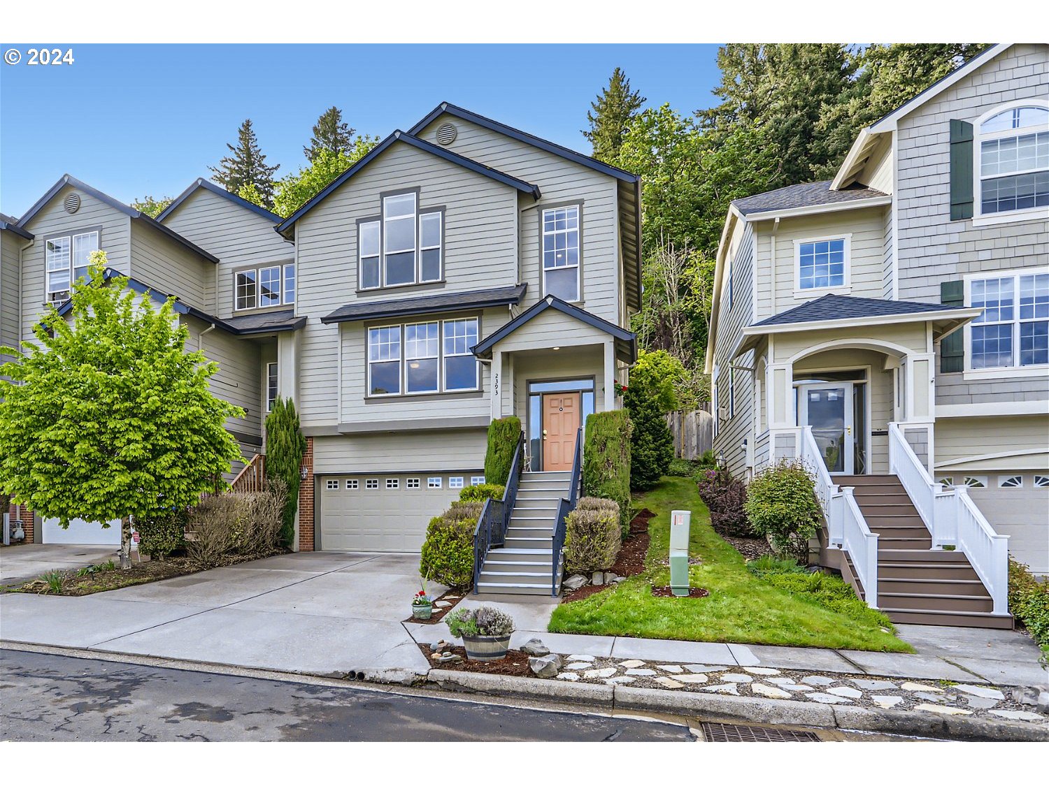 2393 Southwest Border Way Gresham, OR 97080 - Photo 2 of 30 a front view of a house with garden