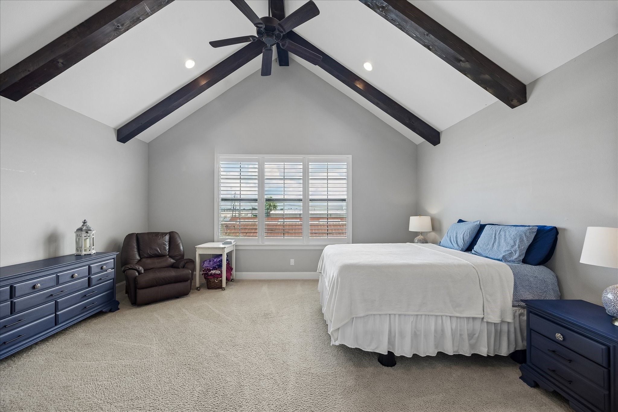 1915 Spring Street Houston, TX 77007 - Photo 18 of 40 The large primary bedroom has a beamed cathedral ceiling with a fan and recessed lights