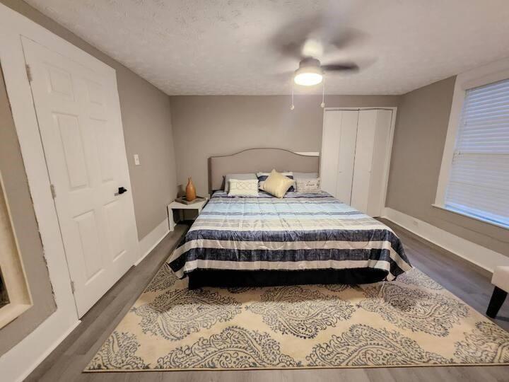455 Lynch Avenue Northwest Atlanta, GA 30318 - Photo 11 of 11 a bedroom with a bed and a rug