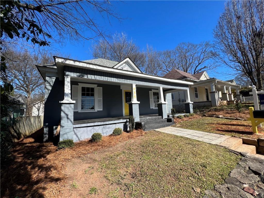 455 Lynch Avenue Northwest Atlanta, GA 30318 - Photo 2 of 11 a front view of a house with a yard