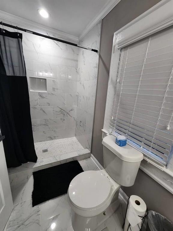 455 Lynch Avenue Northwest Atlanta, GA 30318 - Photo 7 of 11 a bathroom with a toilet a sink and shower