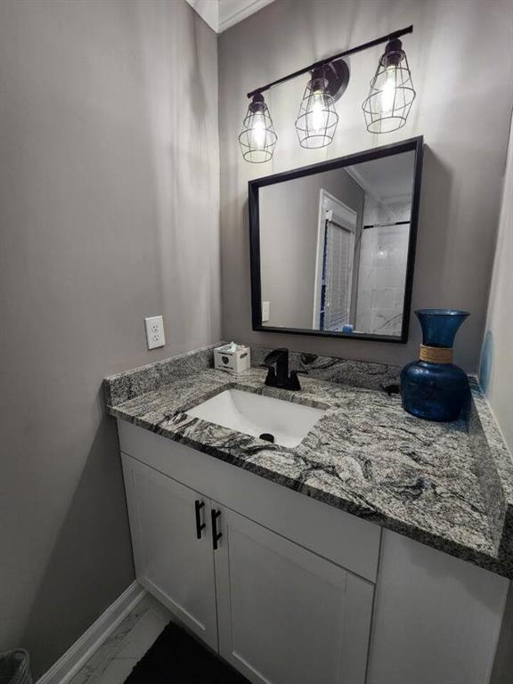 455 Lynch Avenue Northwest Atlanta, GA 30318 - Photo 8 of 11 a bathroom with a granite countertop sink and a mirror