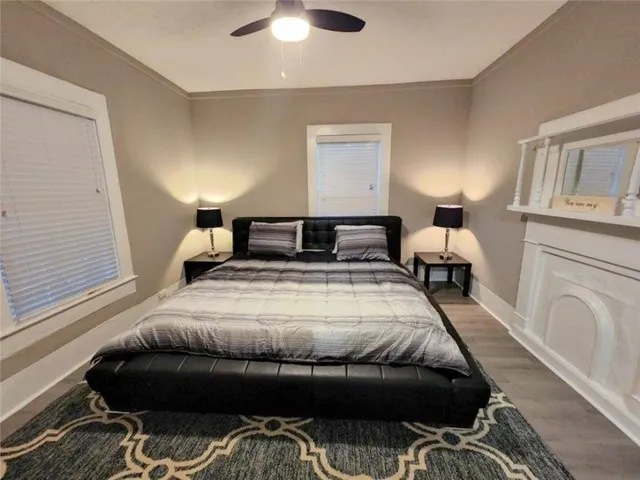 a bedroom with a bed and a rug