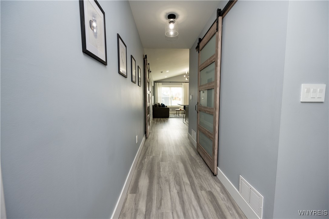 1225 Losson Road Cheektowaga, NY 14227 - Photo 6 of 47 Kitchen Island has a sweep inlet at the baseboard.