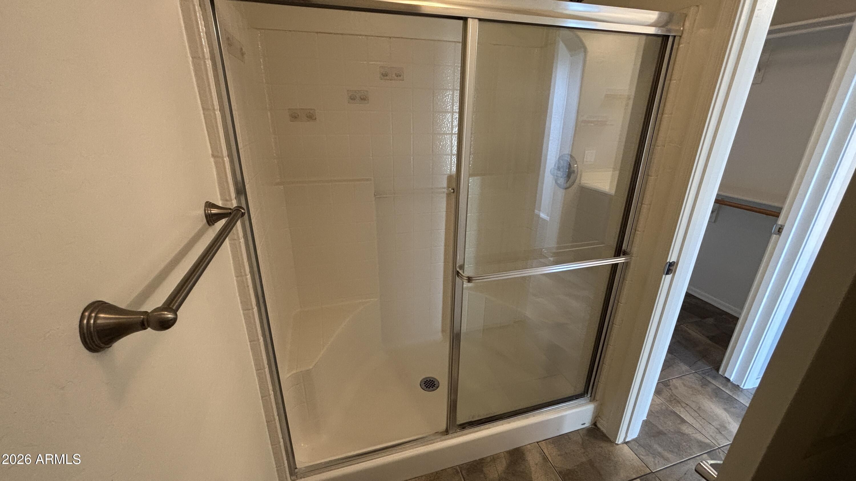 3250 West Greenway Road, Unit 104 Phoenix, AZ 85053 - Photo 16 of 26 a bathroom with a shower