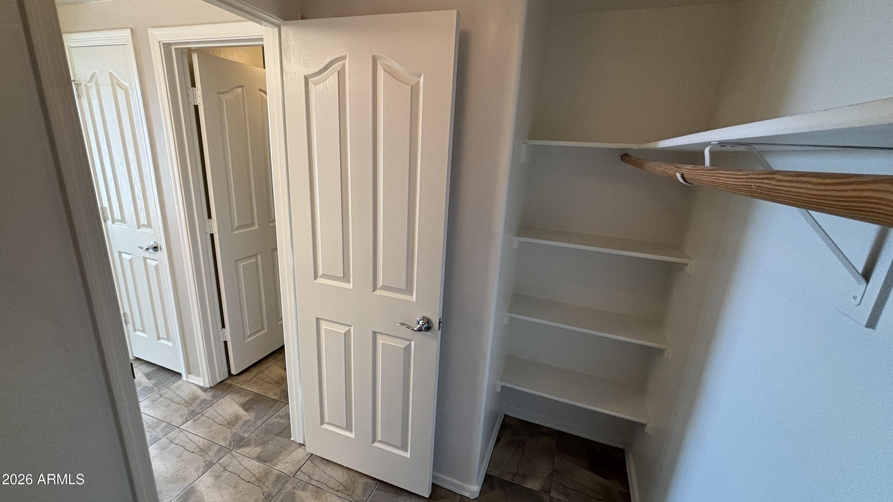 3250 West Greenway Road, Unit 104 Phoenix, AZ 85053 - Photo 17 of 26 a view of a closet in a room