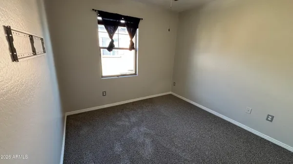 an empty room with closet area