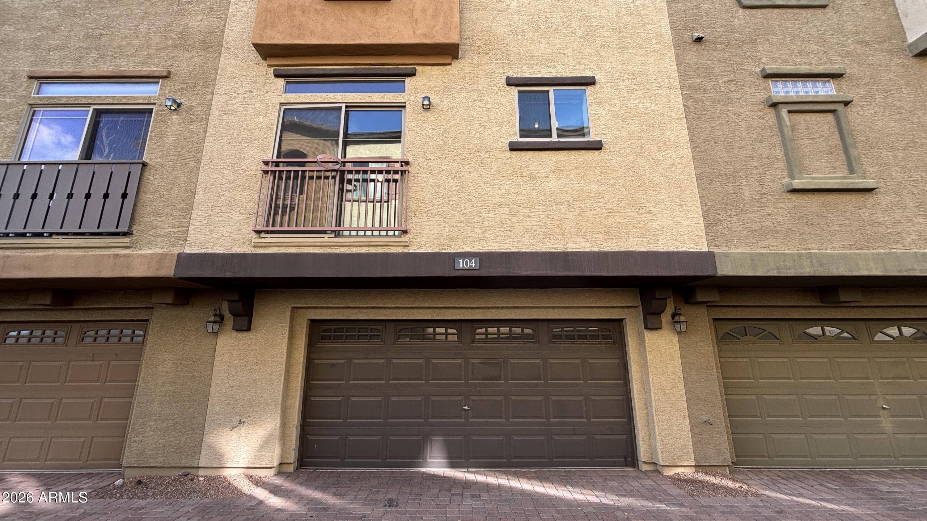 3250 West Greenway Road, Unit 104 Phoenix, AZ 85053 - Photo 2 of 26 a front view of a house