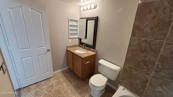 a bathroom with a bathtub and toilet