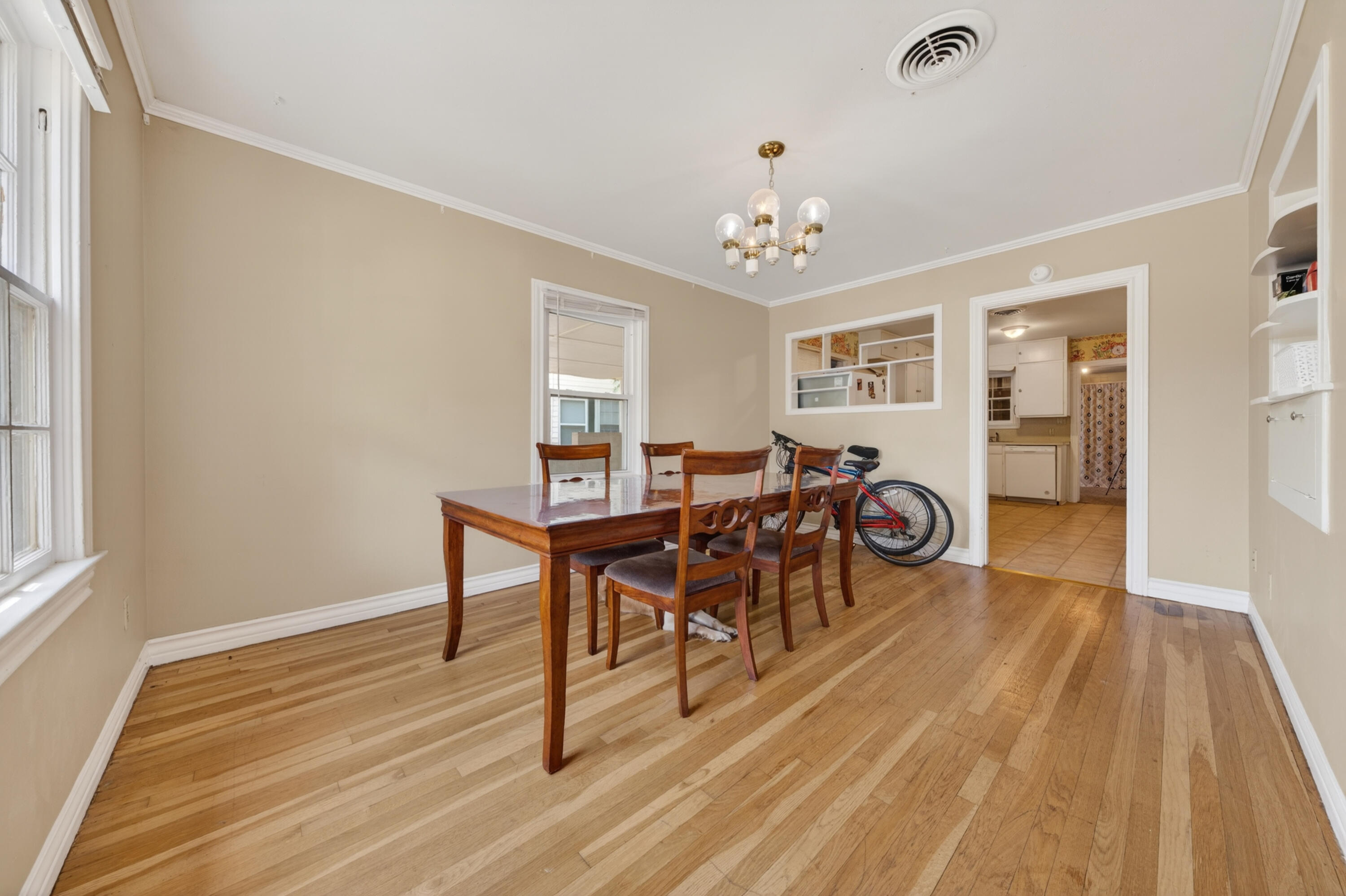2212 22nd Street Lubbock, TX 79411 - Photo 3 of 14 a view of a a dining room with furniture window and wooden floor