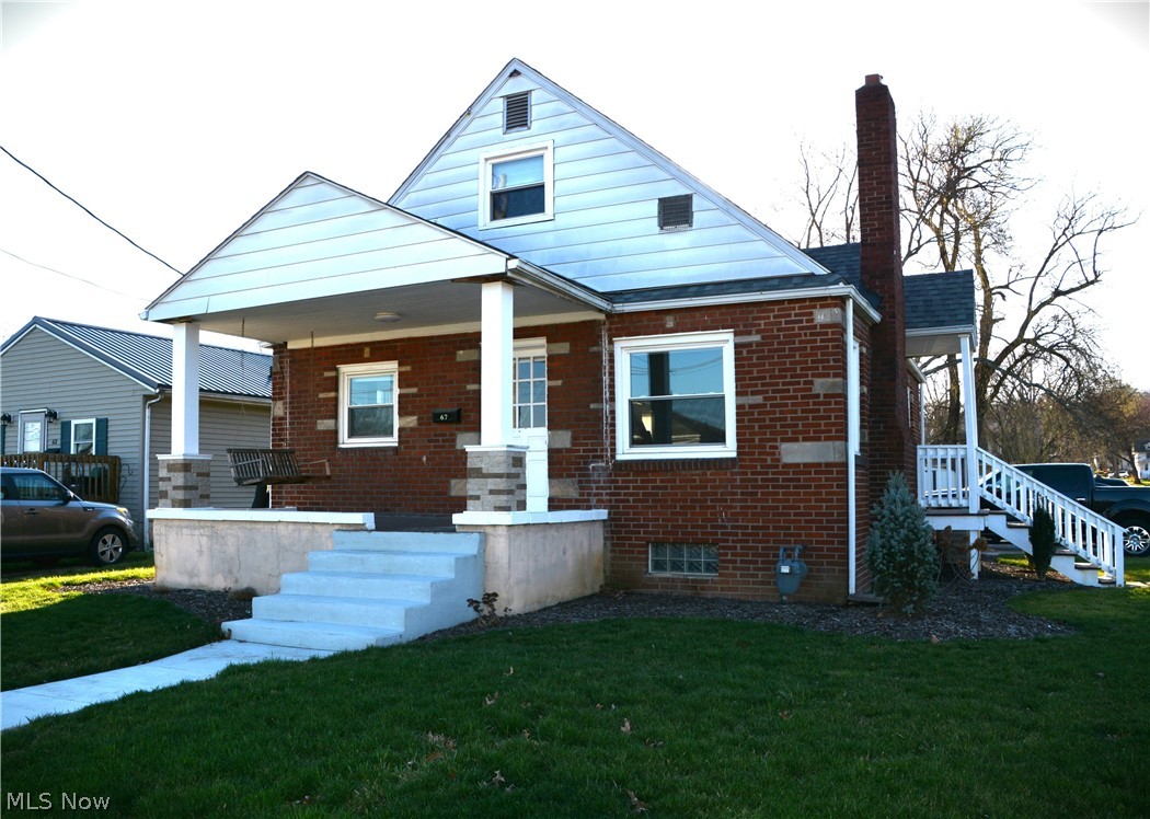 67 Medina Street Rittman, OH 44270 - Photo 1 of 26 View of front of property featuring a porch and a front yard