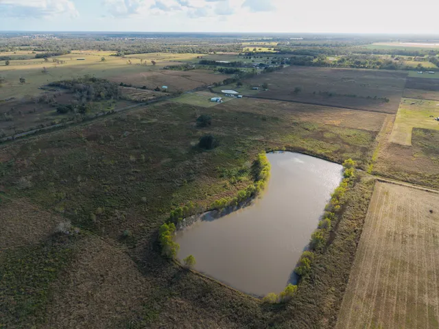 a view of a lake with houses in the background