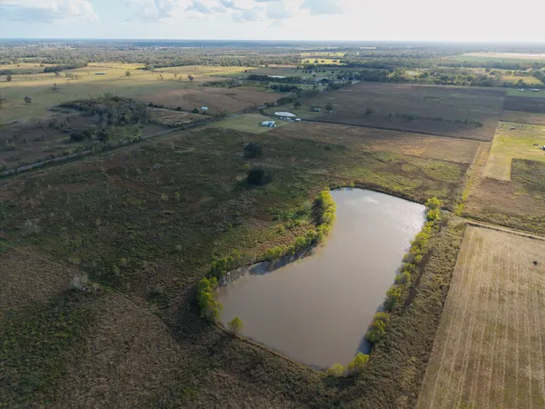 a view of a lake with houses in the background