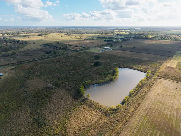 a view of a lake with houses in the back