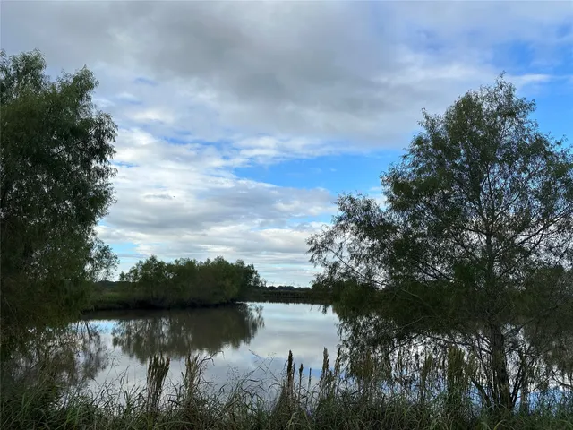 a view of lake with green space
