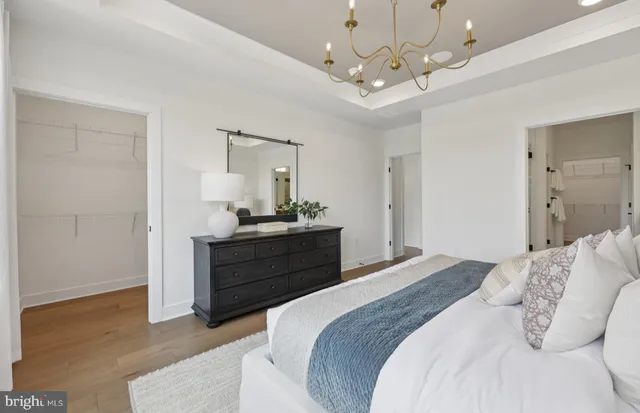 a spacious bedroom with a large bed and a window