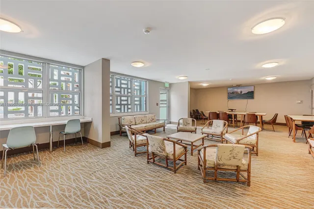 a swimming pool with barbeque oven outdoor seating and yard in back