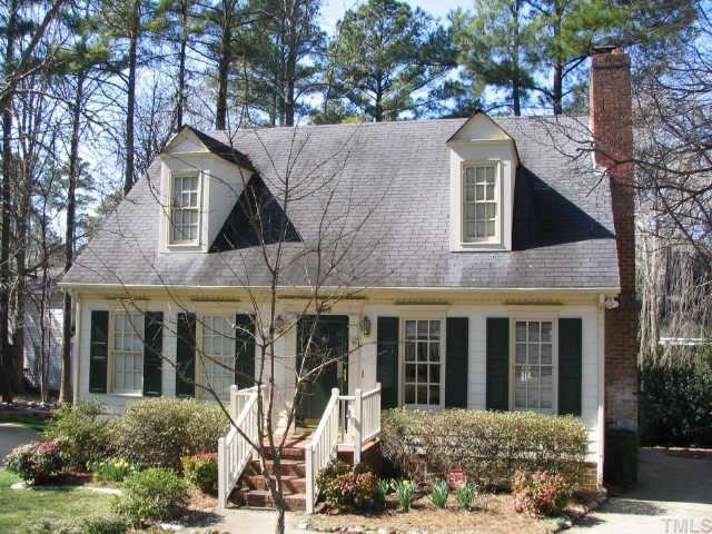 4509 Rutland Court Raleigh, NC 27613 - Photo 1 of 1 a view of a white house with large windows and a tree