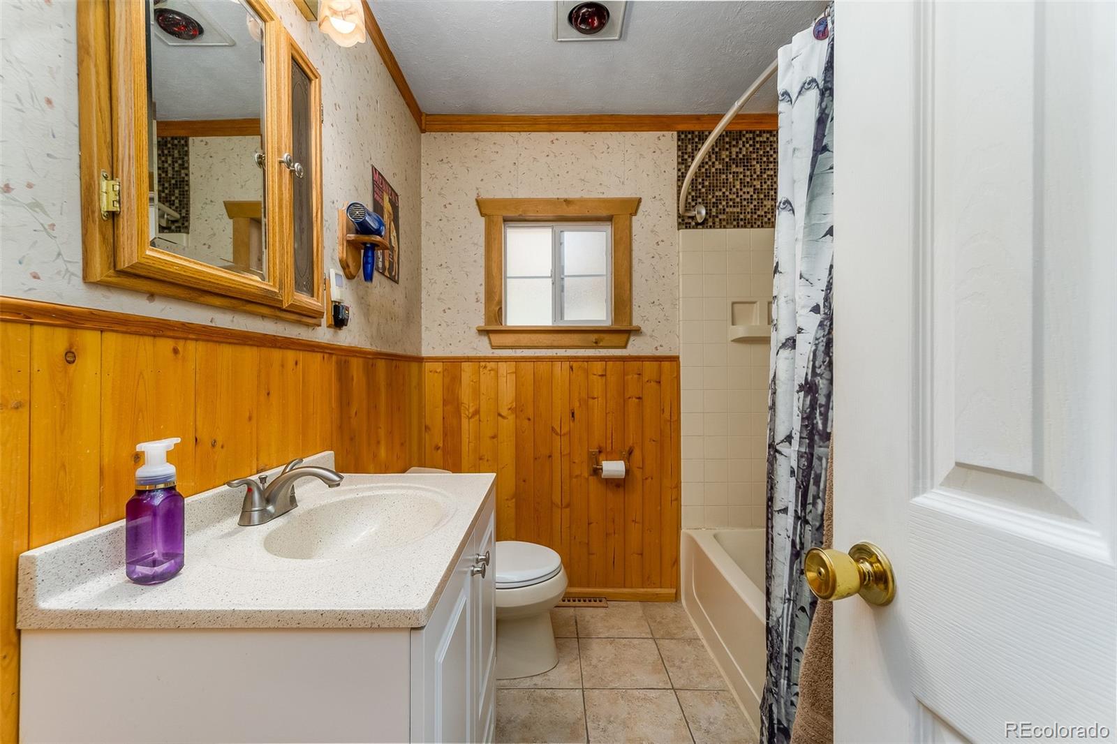 104 Mountain House Road Black Hawk, CO 80422 - Photo 17 of 32 a bathroom with a sink toilet and shower